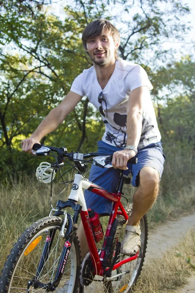 Biking with a smile — Stockfoto